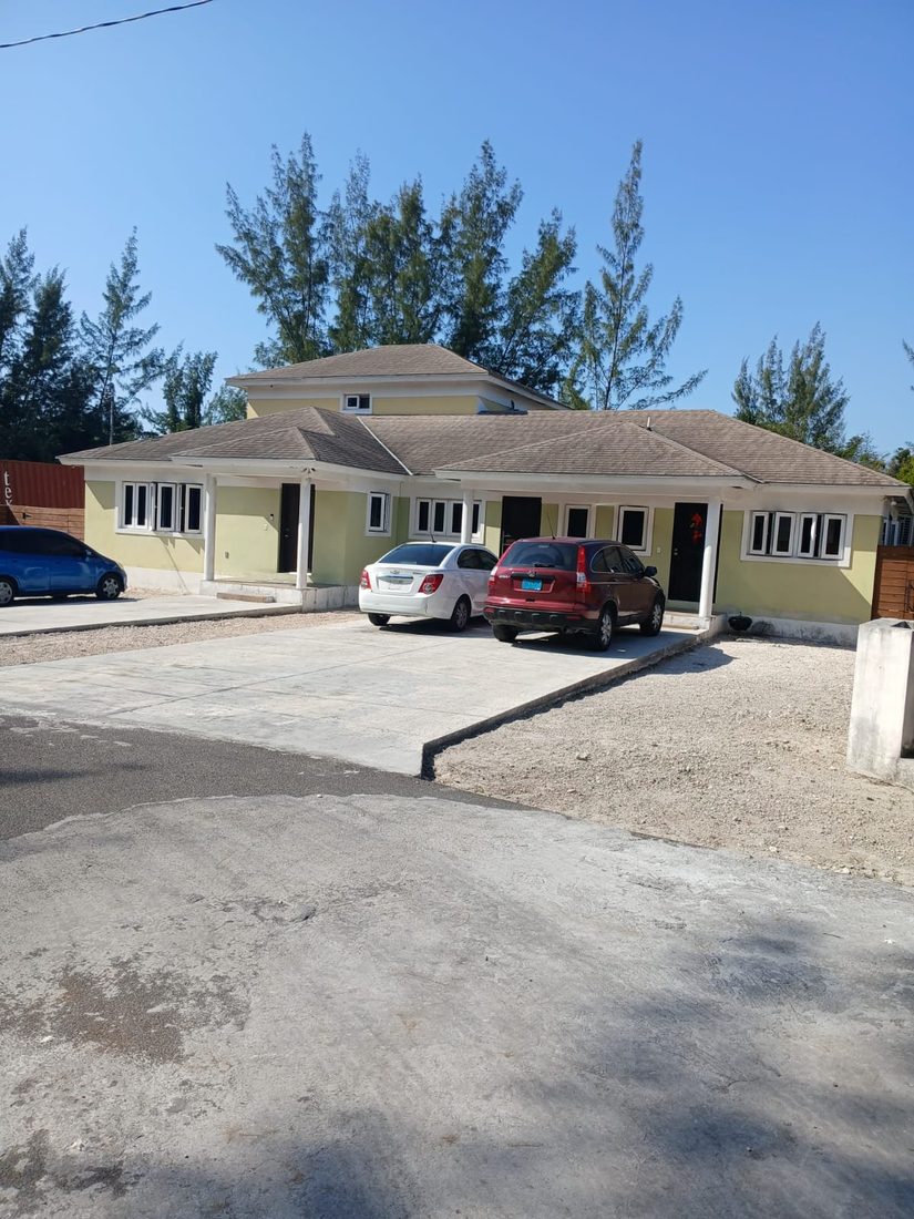 Building after cleaning and painting, clean green and cream walls