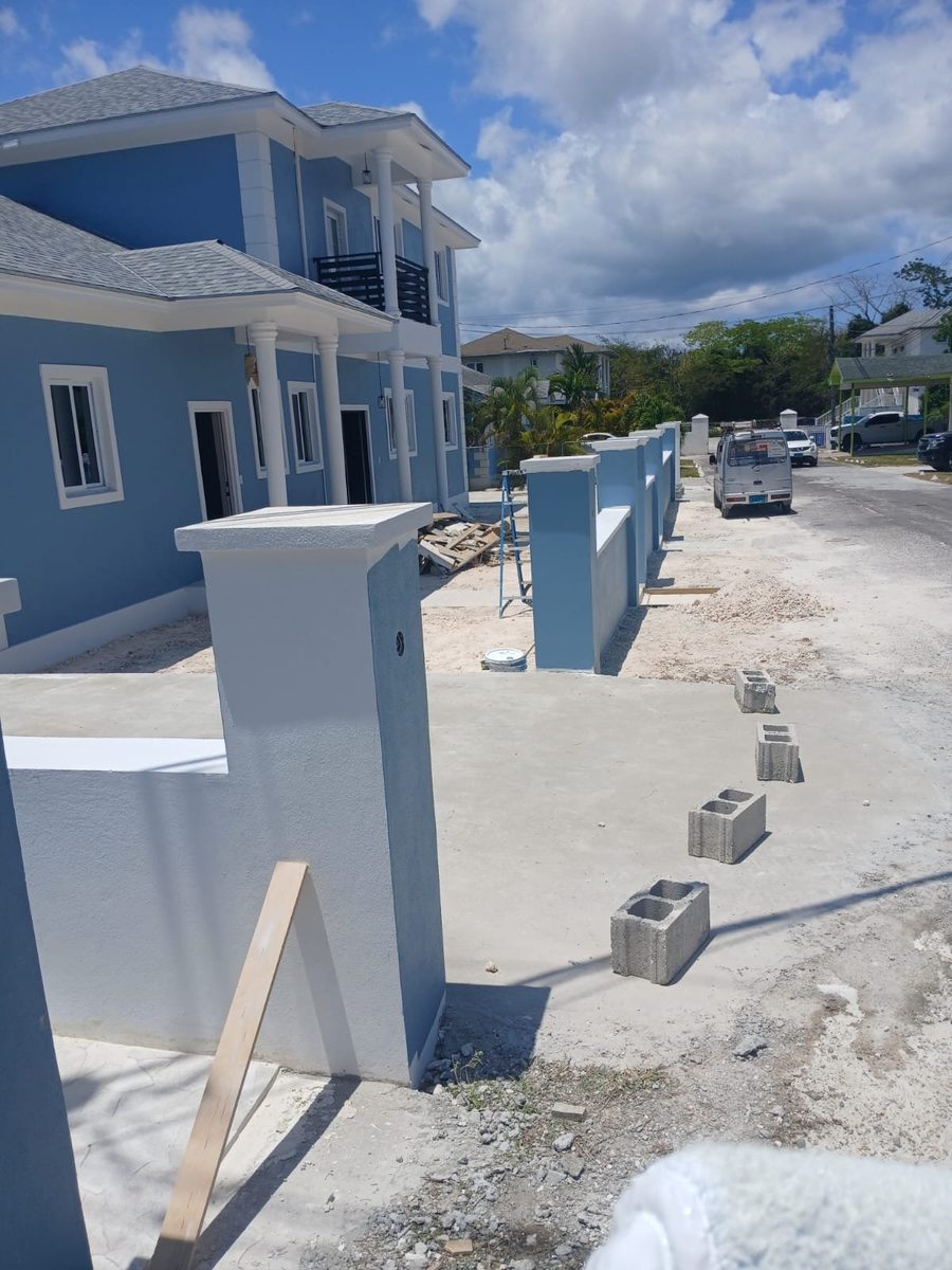 Powder blue two-story home with fresh white columns