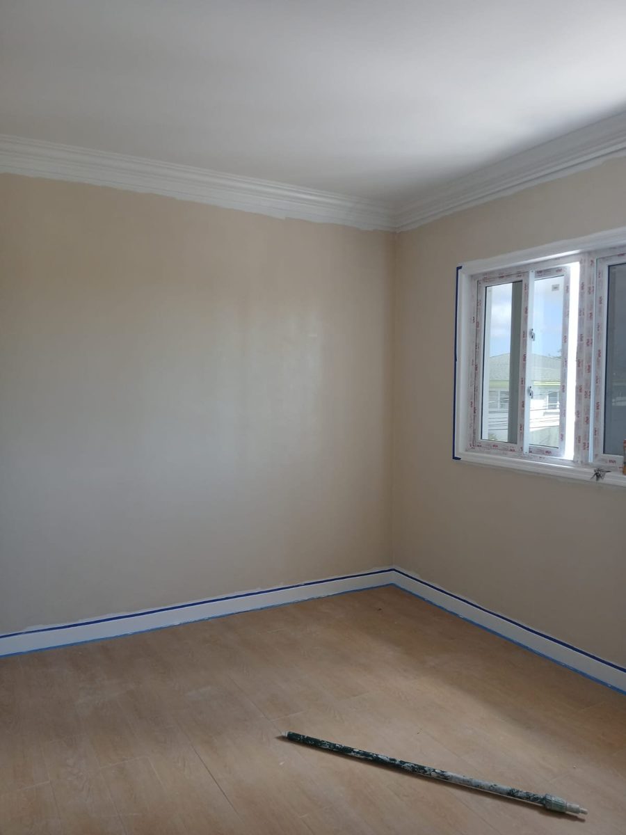 Freshly painted bedroom with white crown molding